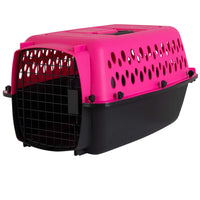 The Aspen Pet Petmate All Purpose Kennels- Pet Porter is a pink and black plastic carrier for small pets, featuring a metal grid door (open) and ventilation holes on the sides and top for safety during transport.