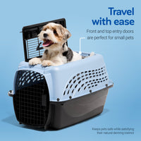 A small, happy dog sits in a blue and black Petmate E-Z Load Two Door Dog & Cat Kennel. Travel with ease—front and top entry doors are ideal for small pets. Mesh sides and a secure design keep your pet comfortable and safe.