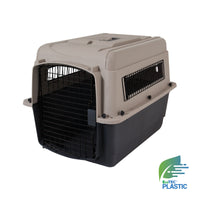The Petmate Traveler - Ultra Vari Kennel by Petmate is a beige and black pet carrier with a metal front door and side ventilation panels, ideal for trips or vet visits. The EcoTEC Plastic logo appears in the bottom right corner.