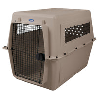 The Petmate Traveler - Ultra Vari Kennel by Petmate is a durable beige plastic pet carrier with a black metal door and side ventilation, ideal for safely transporting or housing dogs or cats.