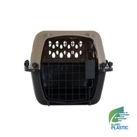 The Petmate All Purpose Kennel - Vari is a beige and black pet carrier with a metal grid door, shown from the front. The EcoTEC Plastic logo appears in the lower right. Its design and features meet many air travel requirements.