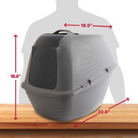 An Arm & Hammer Hooded Wave Litter Box in gray, featuring antimicrobial protection and odor control, is placed on a wooden surface. Red arrows highlight its dimensions: 18.6 height, 18.0 width, and 22.6 length, with a human silhouette in the background for scale.