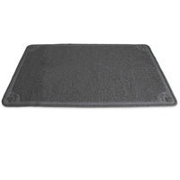 The Petmate Extra Large Litter Catcher Mat is a gray, rectangular doormat with a textured surface and small paw prints at each corner. Its perfect for your cats litter box area, effectively catching litter while lying soft and flat on the floor.