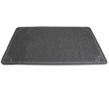 The Petmate Extra Large Litter Catcher Mat is a gray, rectangular doormat with a textured surface and small paw prints at each corner. Its perfect for your cats litter box area, effectively catching litter while lying soft and flat on the floor.