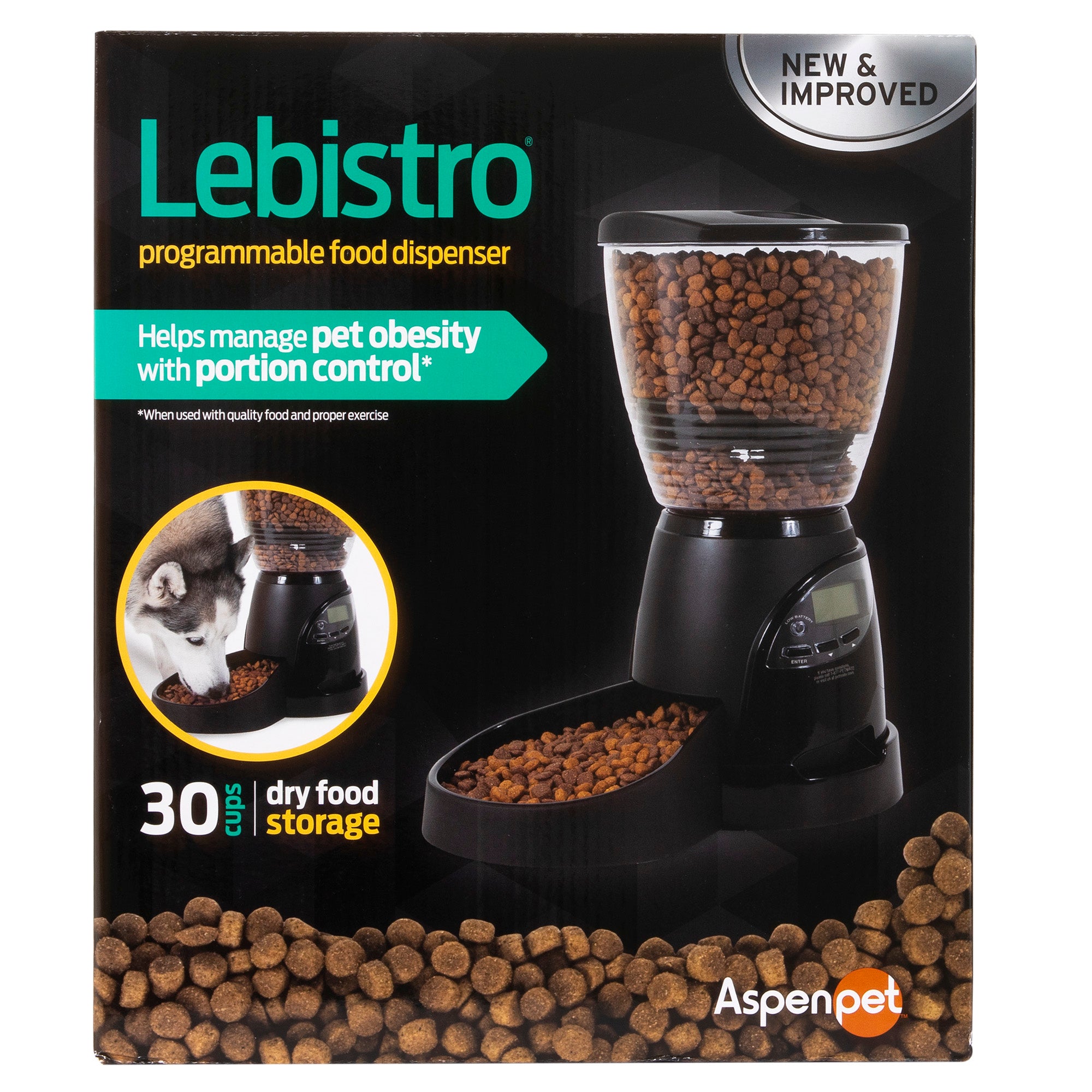 The image shows the Aspen Pet Lebistro Programmable Food Dispenser. With a clear container and digital control base, it holds 30 cups of kibble for portion management to help prevent obesity. A dog eats from it contentedly.