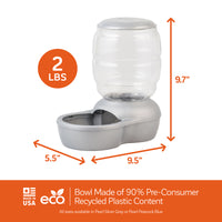 The Petmate Replendish Pet Feeder With Microban is an automatic pet water dispenser featuring a sleek silver base and clear container, measuring 5.5 x 9.5 x 9.7. Made in the USA from eco-friendly materials, it offers gravity-controlled feeding and holds 2 lbs of water with antimicrobial protection.