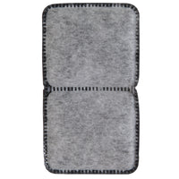 The Petmate Fresh Flow Replacement Charcoal Filter by Petmate is a rectangular, gray, felt-like filter with two sections and black, stitched edges featuring a grid pattern. Its soft, fibrous texture resembles charcoal filters and is ideal as replacement filters for pet water fountains.