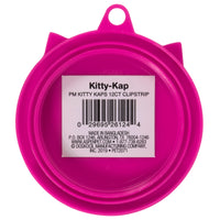 The Petmate Kitty Kaps Pet Food Can Topper is a pink plastic cap with a center barcode and label. It is perfect for keeping pet food fresh. The label displays manufacturing details, brand name, contact info, and states Made in Bangladesh. A top loop allows for easy hanging.