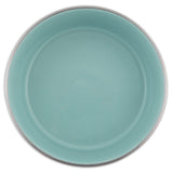 A turquoise round ceramic plate with a smooth surface and raised rim pairs elegantly with Petmates rust-resistant stainless steel bowls for a sophisticated table setting.