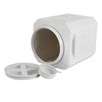 The Vittles Vault Bird Seed Storage Container, a large white, square design with floral accents, lies on its side with the lid and sealing ring removed. It combines functionality and charm for storing bird seed.