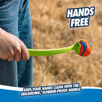 A person holds a Chuckit! Sport Launcher with a vibrant rubber ball, ideal for hands-free play. On dry grass, the image displays Hands Free and Keep your hands clean with the ergonomic, slobber-proof handle, guaranteeing easy, hands-free pickup with this clever Chuckit design.