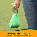 A person holds a green bag filled with pet waste. The text reads: Arm & Hammer Cornstarch Waste Bags infused with Baking Soda for Natural Odor Control. A grassy background highlights these essential Arm And Hammer pet supplies.
