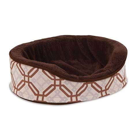 The Petmate Small Dog & Cat Oval Foam Fashion Bed by Petmate offers a plush brown interior and a chic exterior with an interlocking brown and white geometric pattern. Its raised sides enhance comfort, and the bed is machine washable for effortless care.