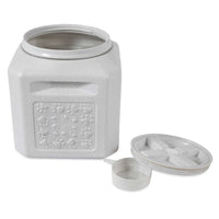 The Vittles Vault Pawprint Outback Food Storage Container is a square, gray plastic bin with embossed paw prints. Made from BPA-free plastic, it includes a lid and matching scoop, offering airtight storage ideal for pet food.