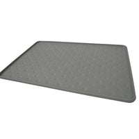 The PetFusion Tough Grip Dog Food Mat by Pet Fusion is a gray, rectangular silicone mat designed for pets. It features a surface pattern of small circular bumps to prevent slipping.