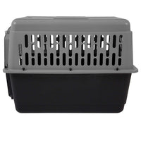 The Aspen Pet Petmate All Purpose Aspen Pet Porter is a gray and black plastic pet carrier with top ventilation slats and a solid bottom, designed for pet comfort and meets most air travel requirements. Shown from the side.