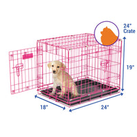 A small puppy is inside a Petmate 2 Door Wire Puppy Crate with an open door. Ideal for house training, this pink crate is 24 high, 19 wide, and 18 deep. An inset silhouette shows the size comparison of a sitting cat to the crate.