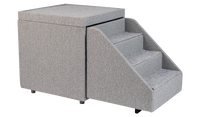 The PetFusion Multi-Purpose Pet Stairs, in premium gray with three steps and a textured fabric for durability, sits beside a soft cube-shaped ottoman, allowing pets to access higher surfaces safely.