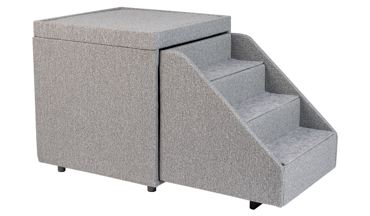 The PetFusion Multi-Purpose Pet Stairs, in premium gray with three steps and a textured fabric for durability, sits beside a soft cube-shaped ottoman, allowing pets to access higher surfaces safely.